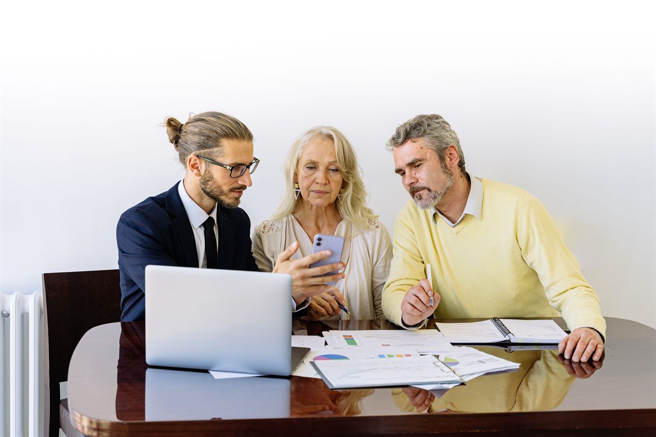 An advisor and a business owner reviewing a loan file together